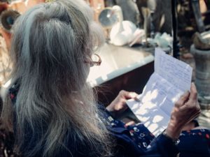 senior woman reading a handwritten letter