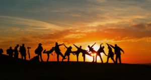 group of people posing in sunset