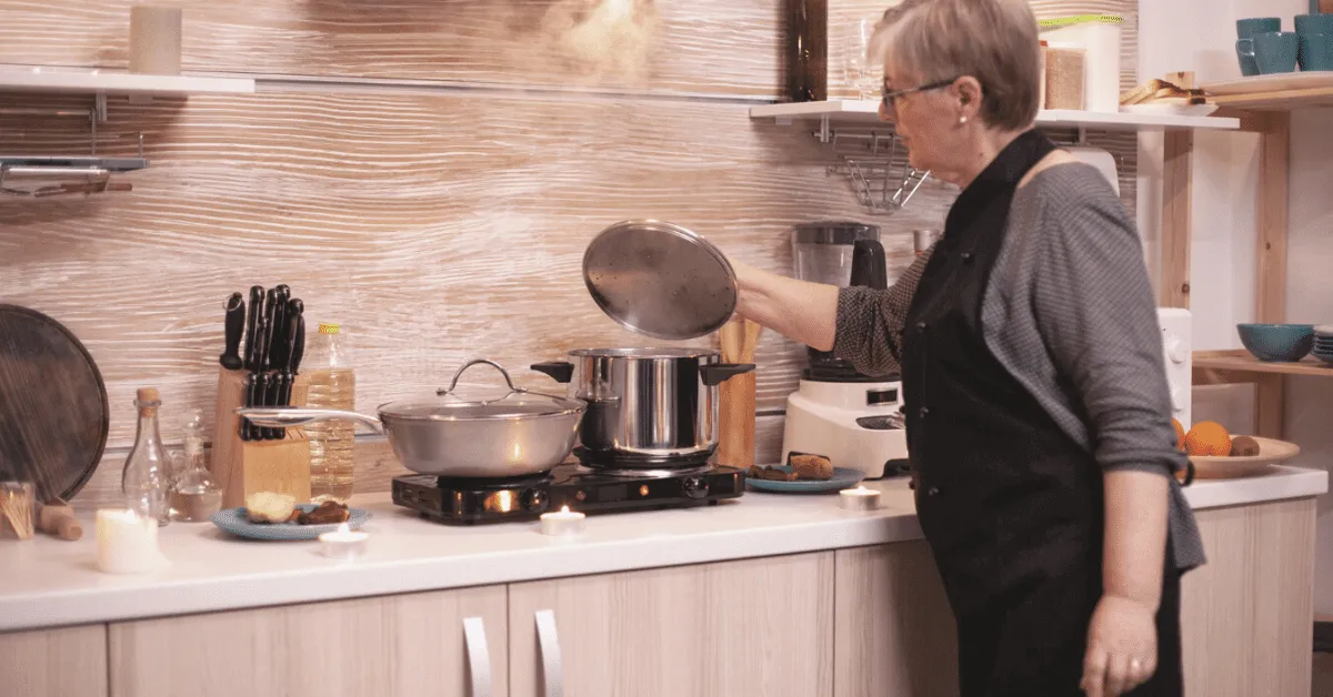 senior woman cooking in a kitchen