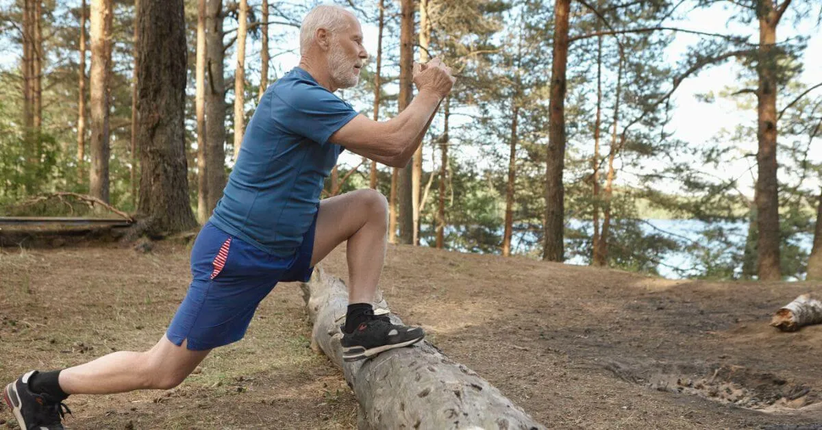 senior man exercising in the woods