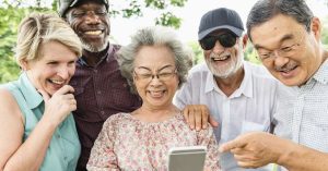 group-happy-retired-seniors-using-digital-device