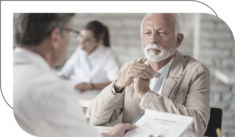 senior man talking to a financial planning advisor in an office