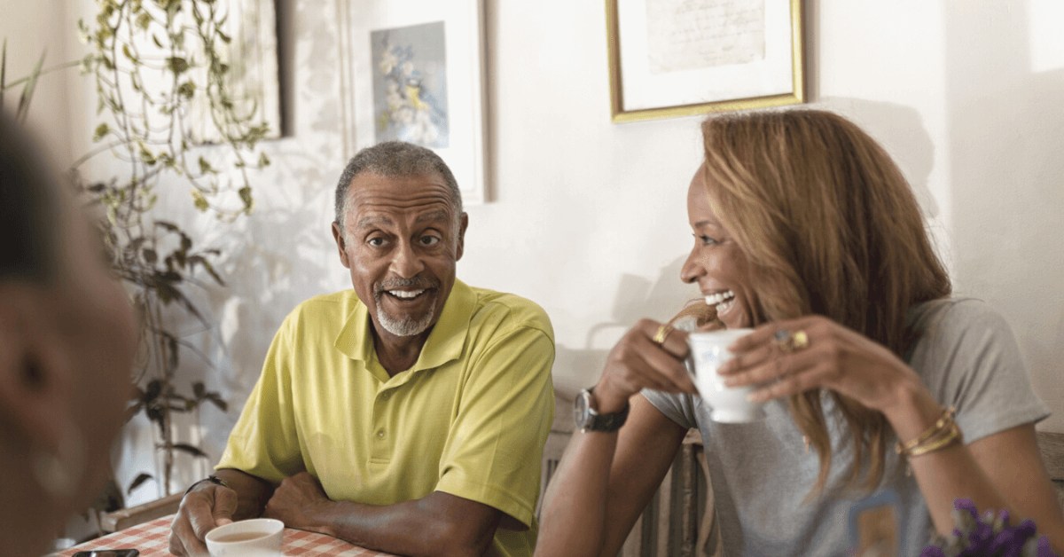 senior couple drinking coffee and laughing